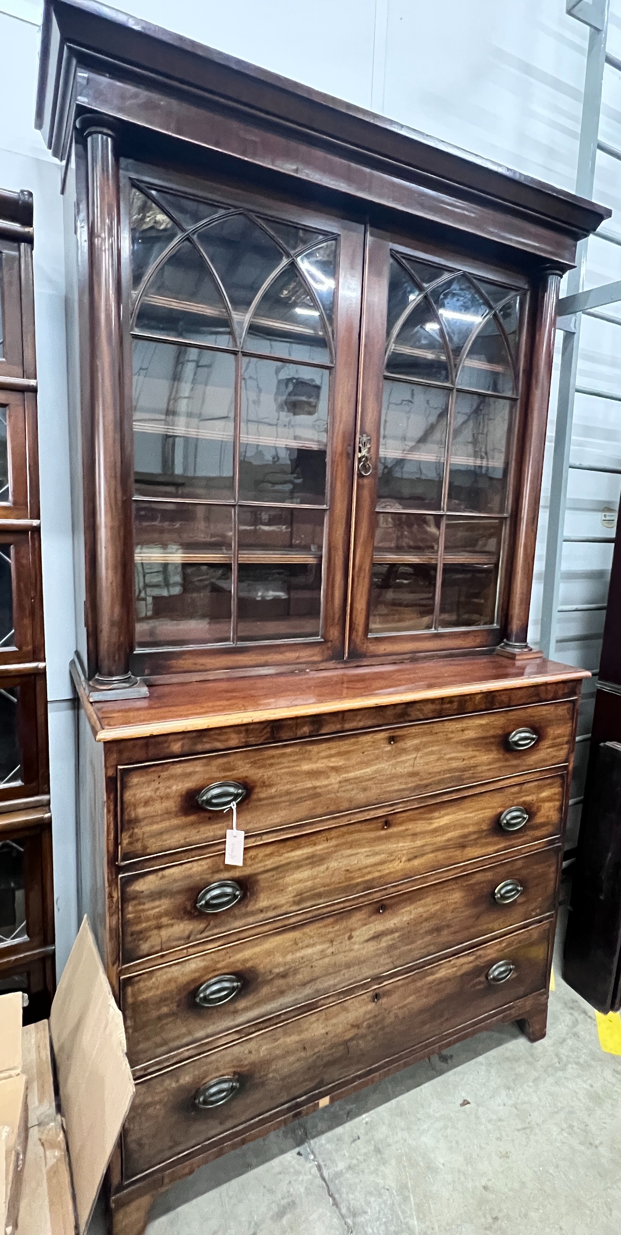 A George IV mahogany secretaire bookcase (top associated), width 125cm, depth 56cm, height 232cm